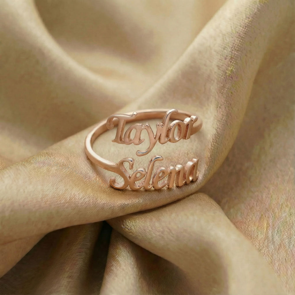 Personalized name ring, one-size in rose gold finish on beige silk fabric