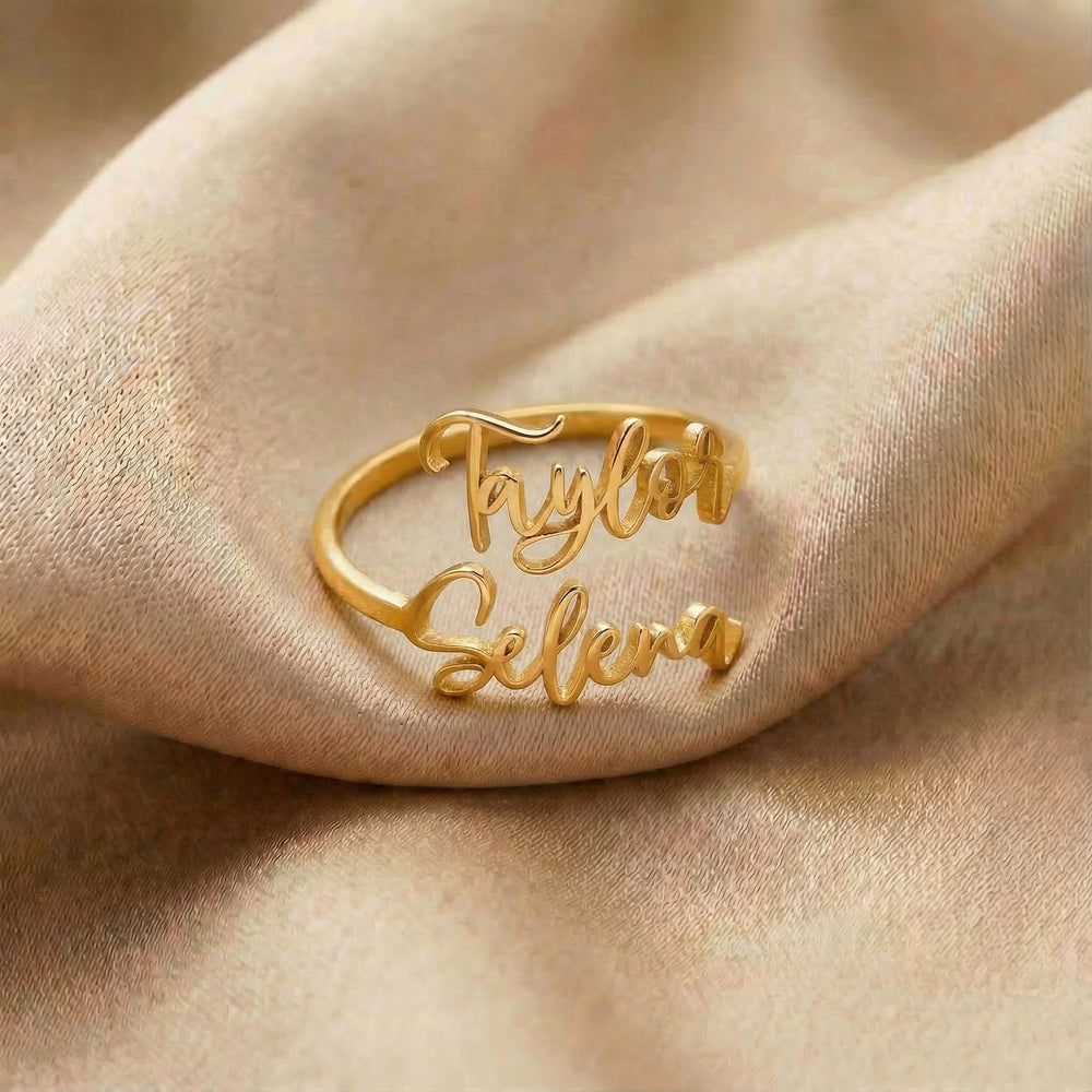 Personalized name ring, one-size in gold finish on beige silk fabric