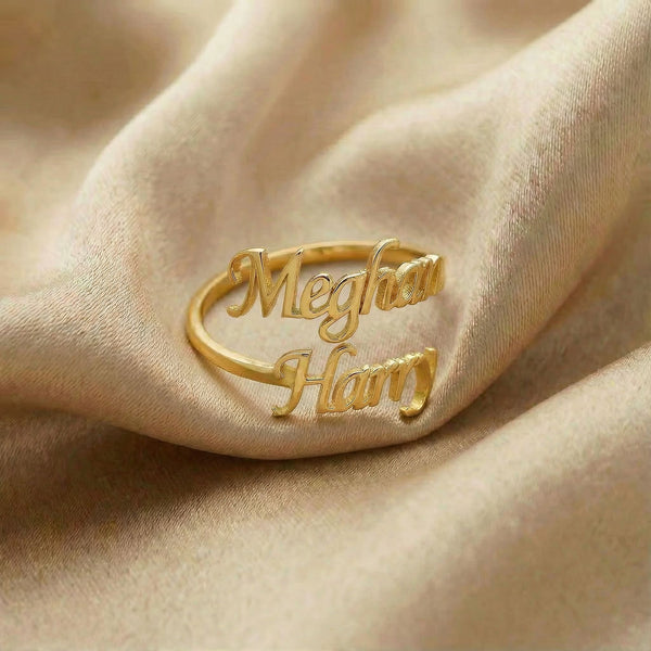 Personalized name ring, one-size in gold finish on beige silk fabric