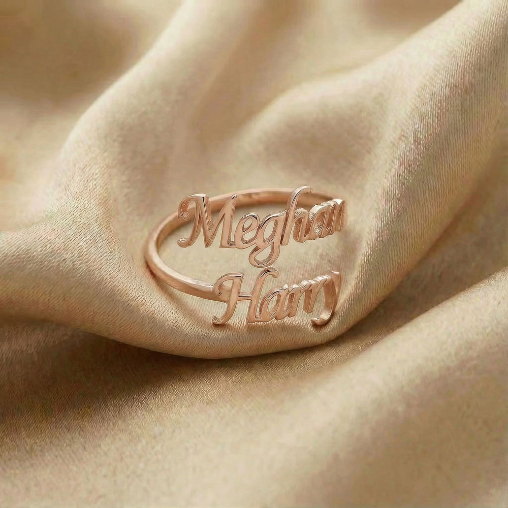 Personalized name ring, one-size in rose gold finish on beige silk fabric