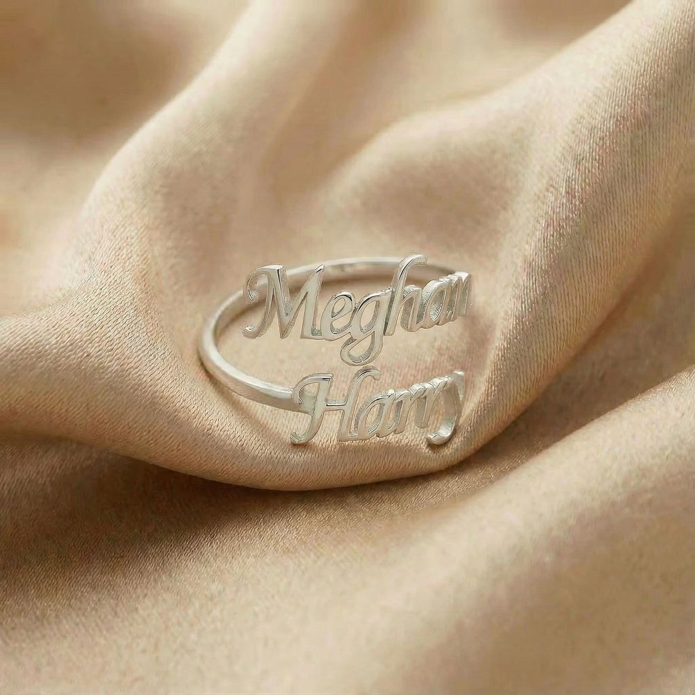 Personalized name ring, one-size in silver finish on beige silk fabric