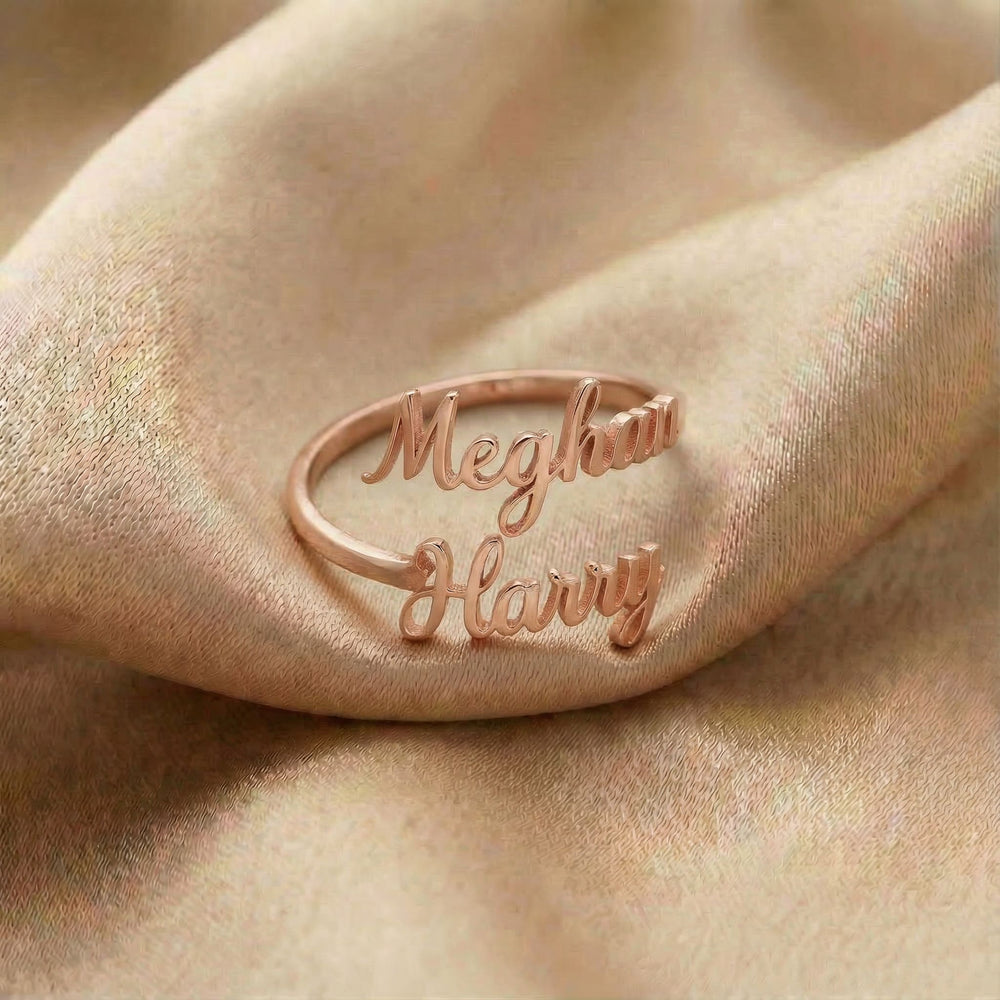 Personalized name ring, one-size in rose gold finish on beige silk fabric