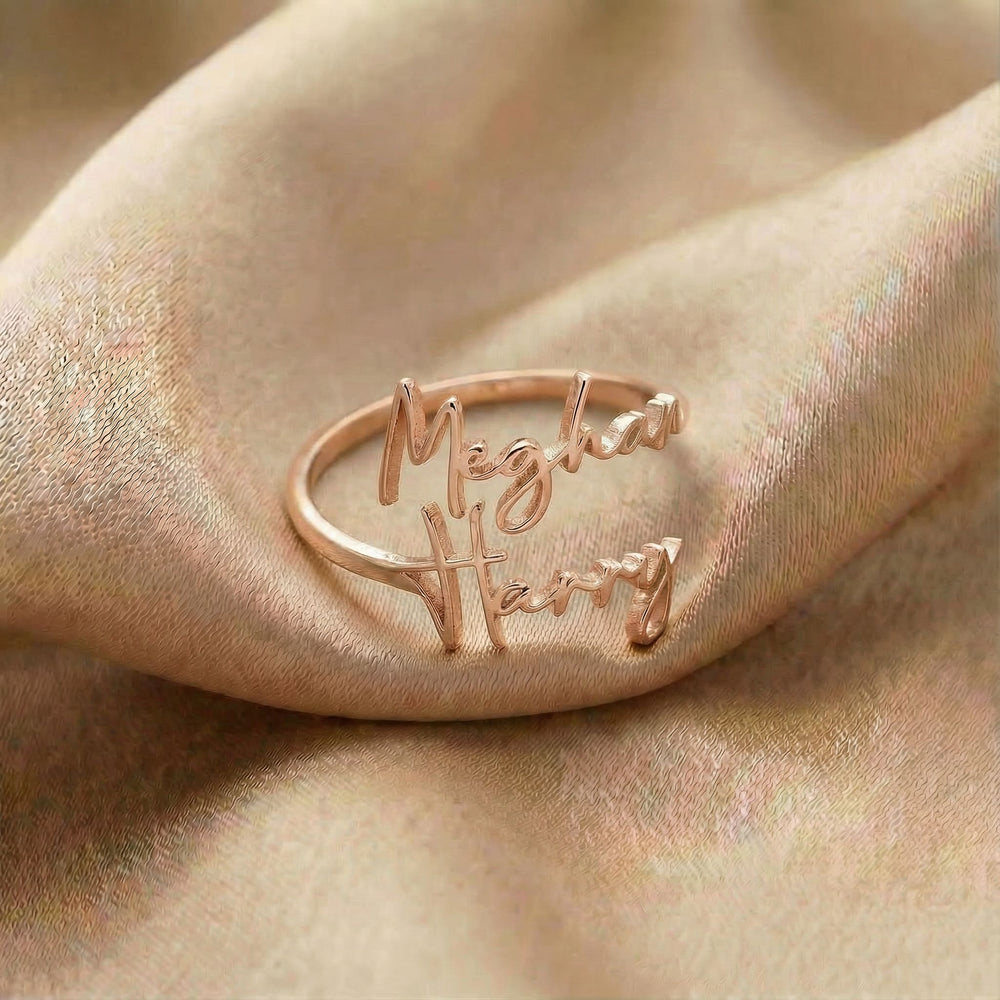 Personalized name ring, one-size in rose gold finish on beige silk fabric