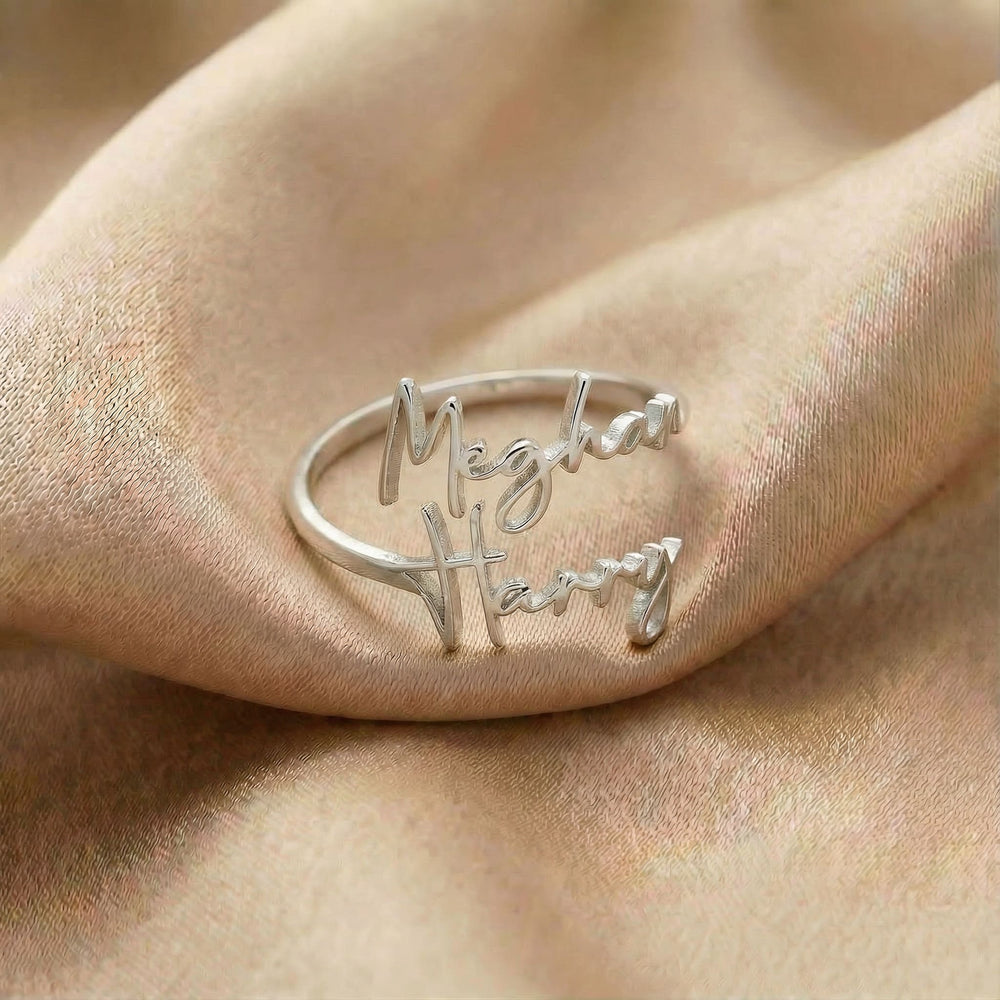 Personalized name ring, one-size in silver finish on beige silk fabric