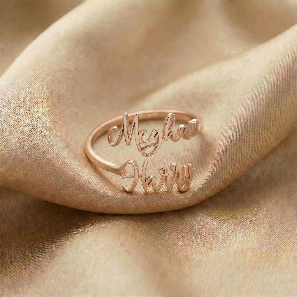 Personalized name ring, one-size in rose gold finish on beige silk fabric