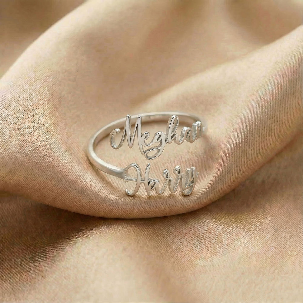 Personalized name ring, one-size in silver finish on beige silk fabric