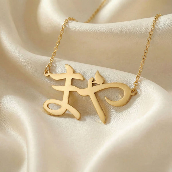 Personalized name necklace in Japanese in gold finish on beige silk fabric