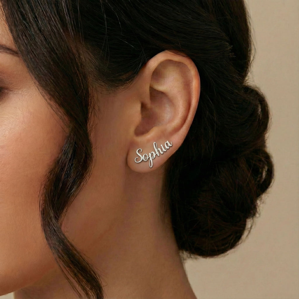 Personalized name ear climber earrings in silver finish worn on ear, side profile view