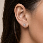 Silver ear climber earring with a kanji symbol meaning "beauty" worn by an person
