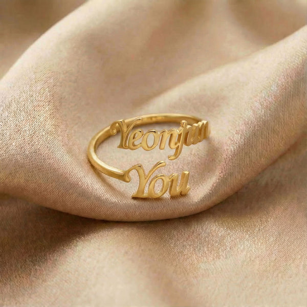 Personalized name ring, one-size in gold finish on beige silk fabric