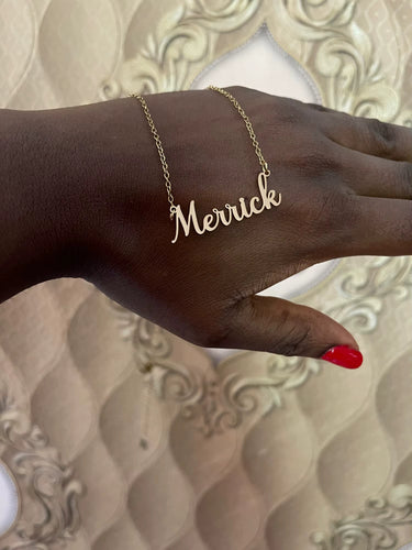 Custom name necklace in silver with Merrick in Romance font, one of 5 elegant script styles.