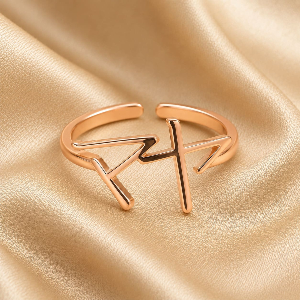 Rose gold ring with Japanese Katakana pendant meaning "Maya" on a beige fabric background
